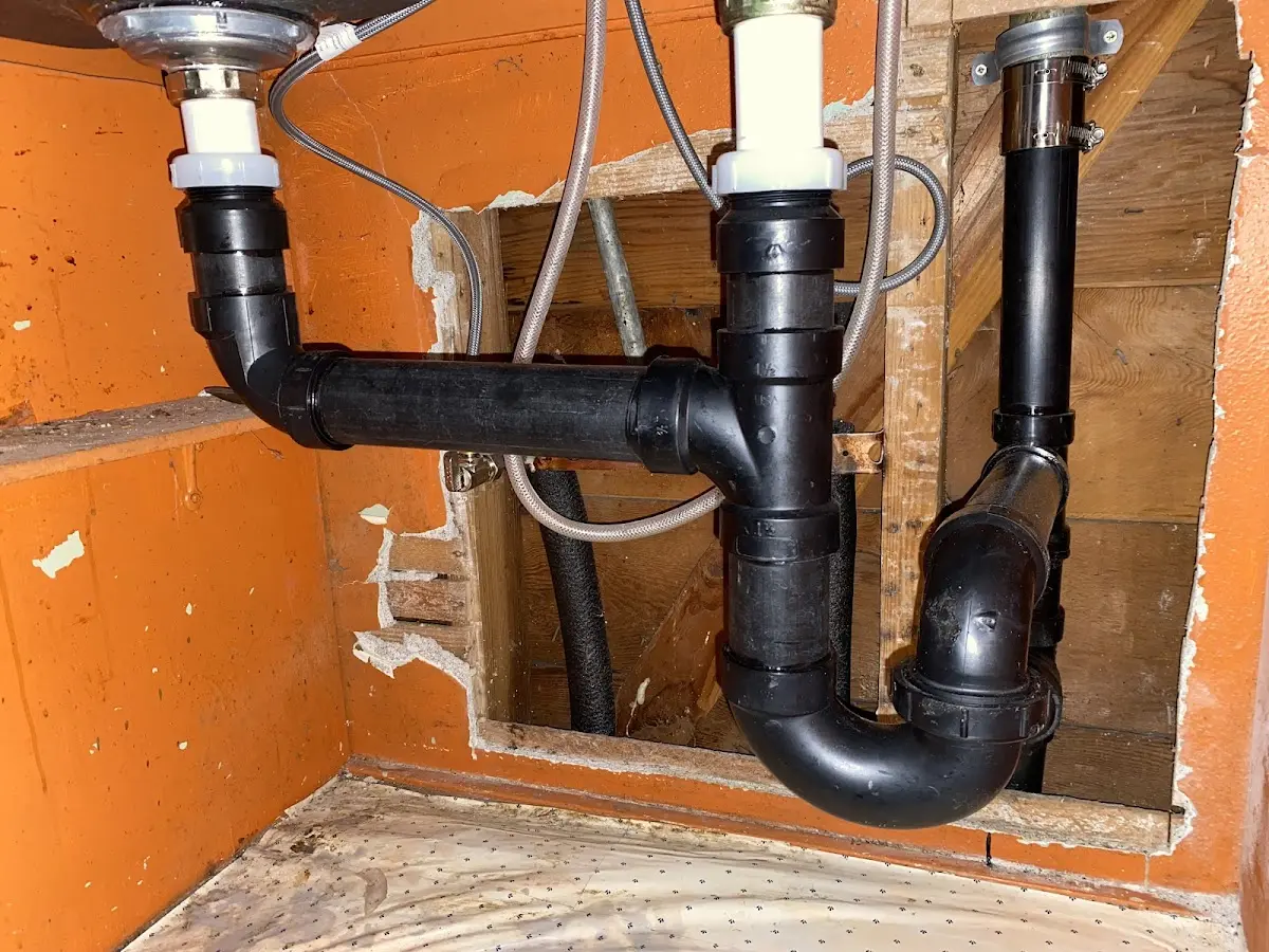 Professional Garbage Disposal Repair equipment and tools on the job in Milton